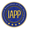 The logo for the international association of press photographers