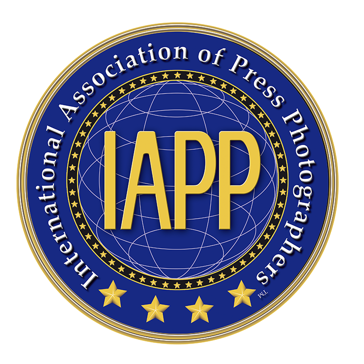 The logo for the international association of press photographers