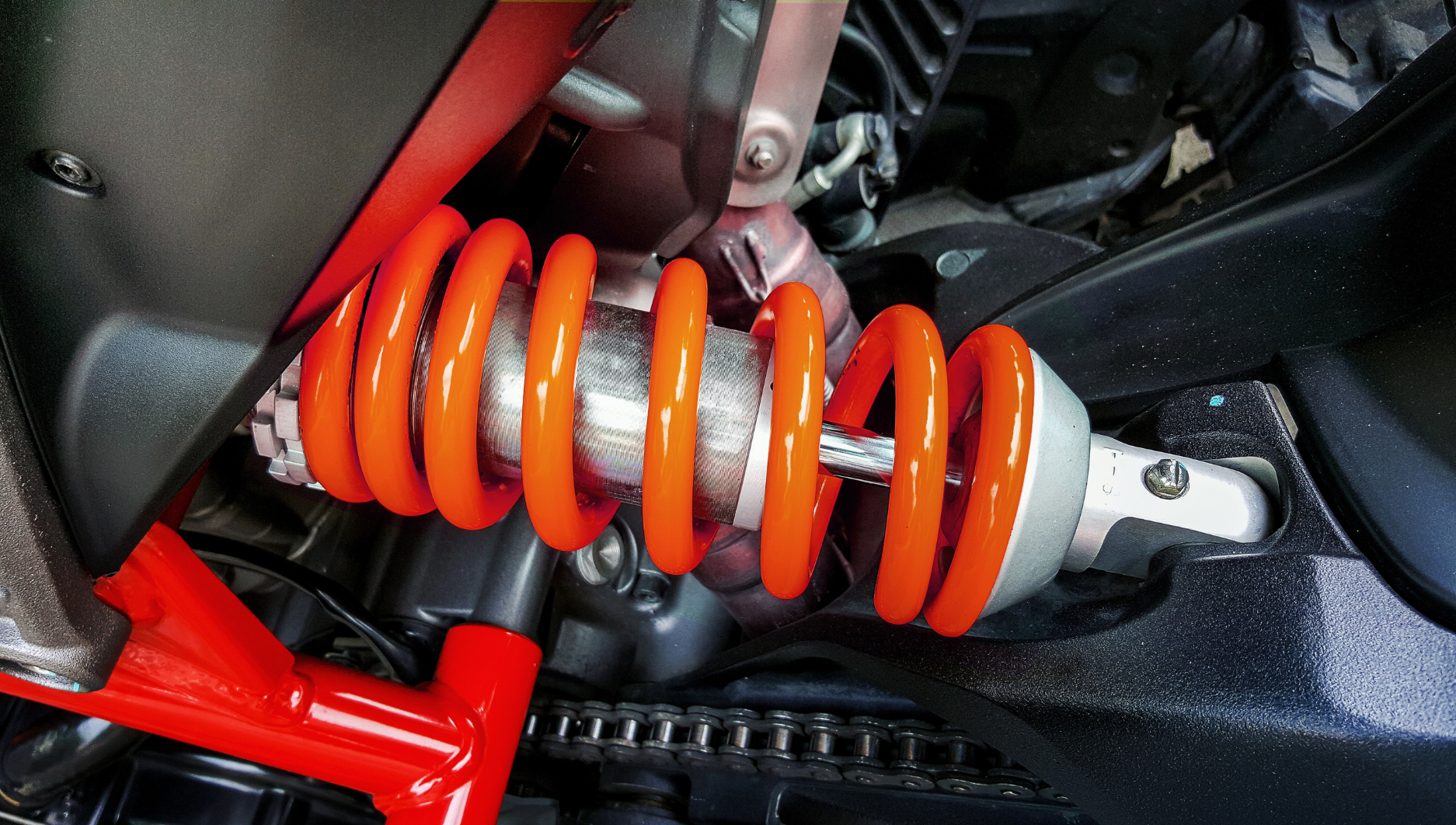 A close up of a shock absorber on a motorcycle