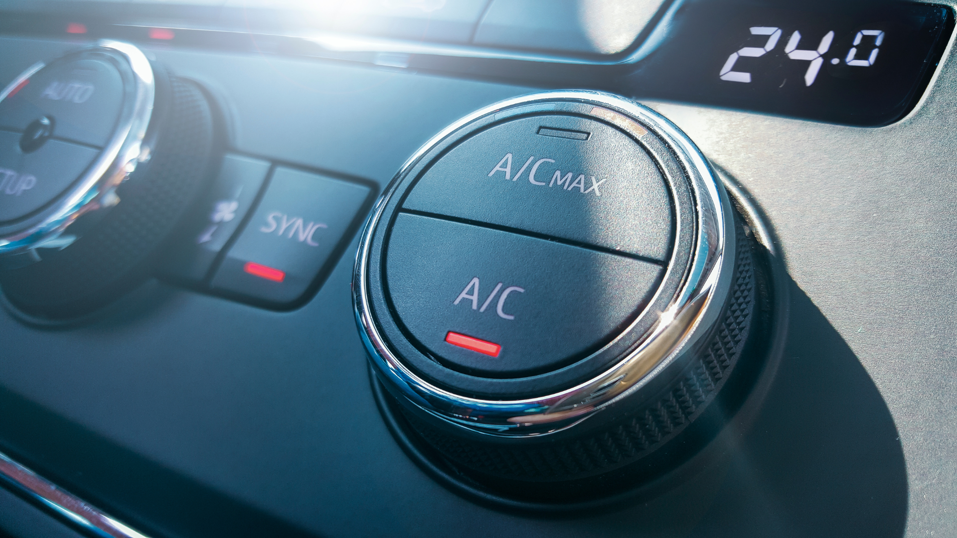 A close up of a car 's air conditioning control.