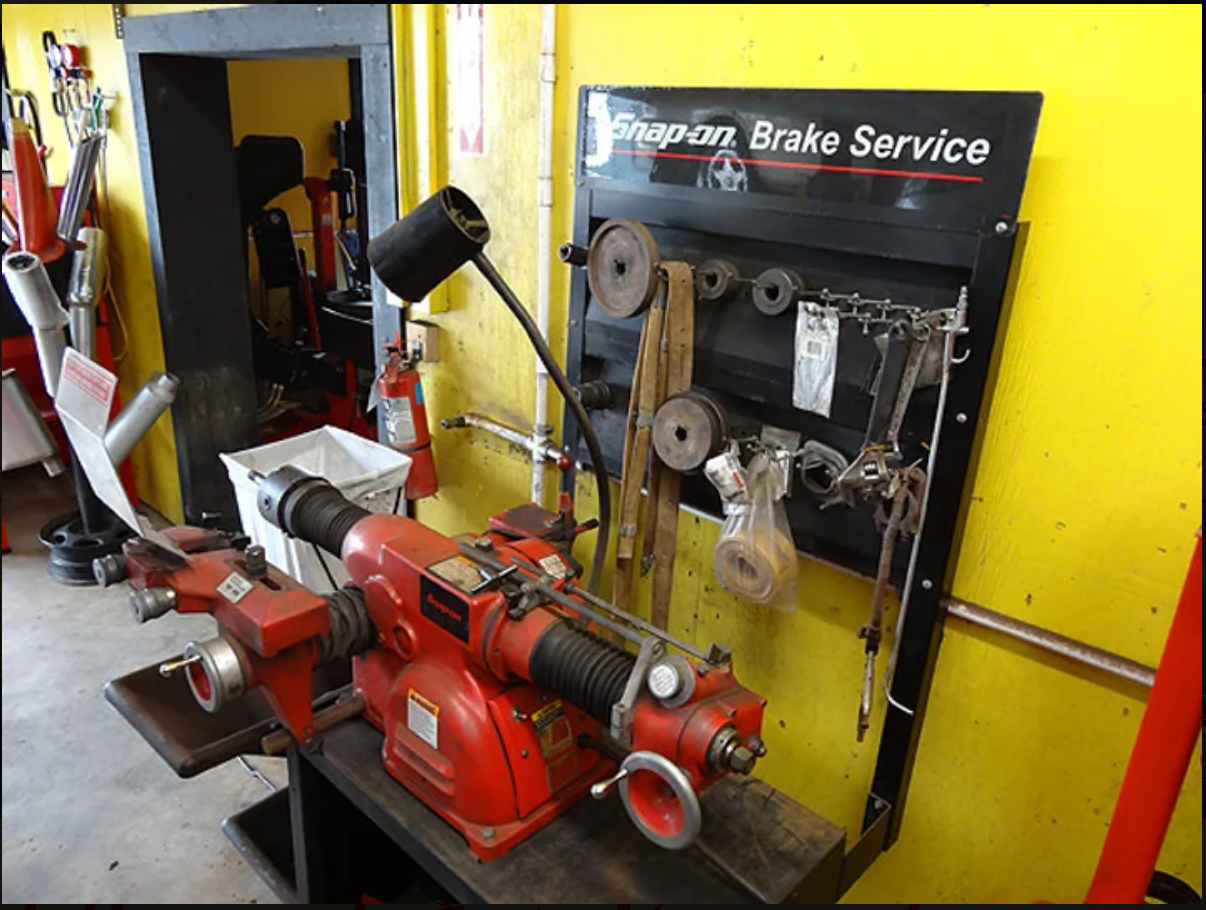 A snap on brake service machine is in a garage