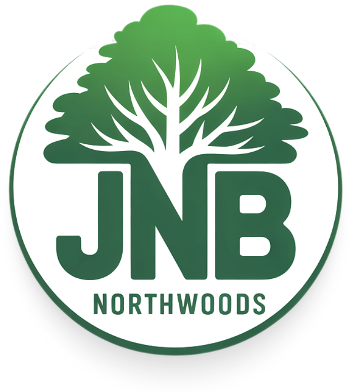 A logo for jnb northwoods with a tree in the center