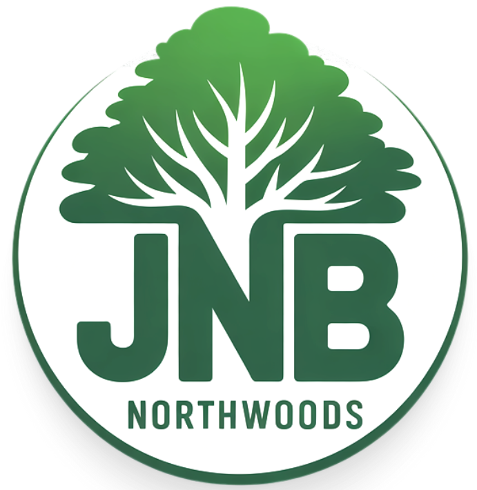 A logo for jnb northwoods with a tree in the center