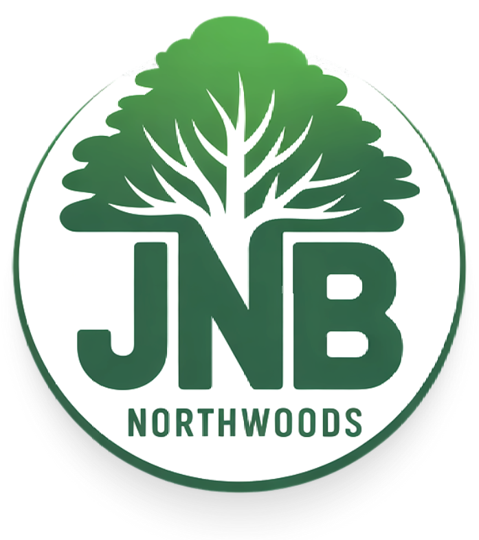 A logo for jnb northwoods with a tree in the center