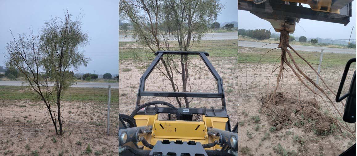 A yellow vehicle is driving through a field next to a tree.