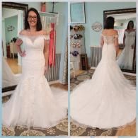 A woman stands in a bridal shop, wearing a white off-the-shoulder, mermaid-style wedding dress shown from front and back.