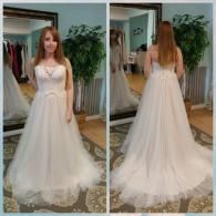 A split-view showing the front and back of a white strapless A-line wedding dress with a tulle skirt in a bridal shop.