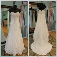 Two views of a white, strapless, A-line wedding dress with lace floral details and a train, shown on mannequins in a shop.