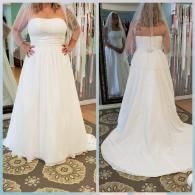 A person wears a strapless, white A-line wedding dress with a train and veil, shown from the front and back in a shop.
