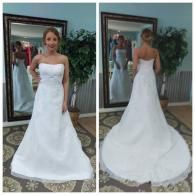 A bride poses in a strapless, A-line white wedding dress, shown from the front and back in a mirror.