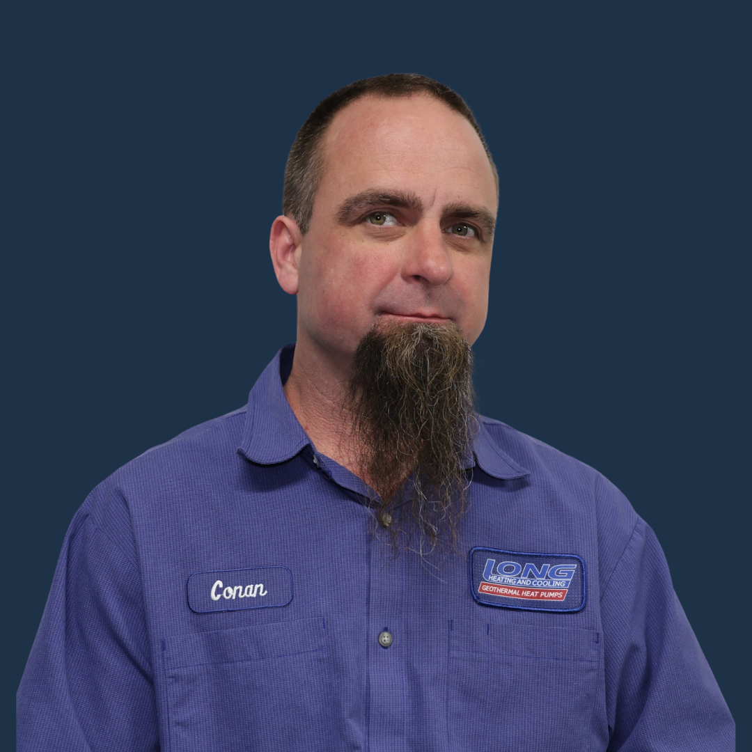 Man with beard in blue work shirt, name tag 