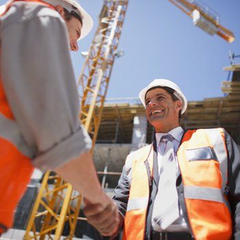 Surety Bond Agents — Construction Worker Shaking Hands With Co-Worker in Sacramento, CA