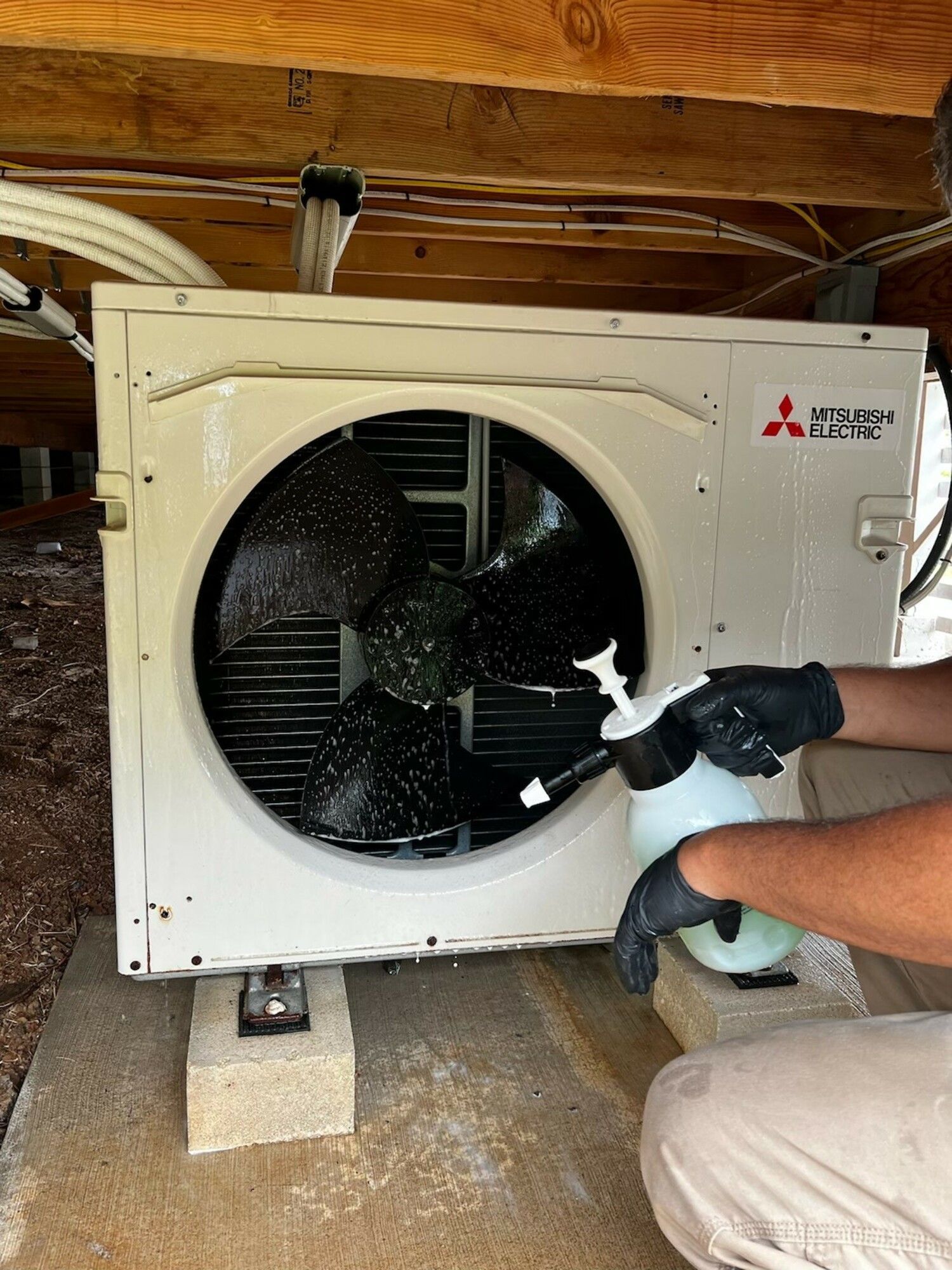HVAC tech fixing air conditioner