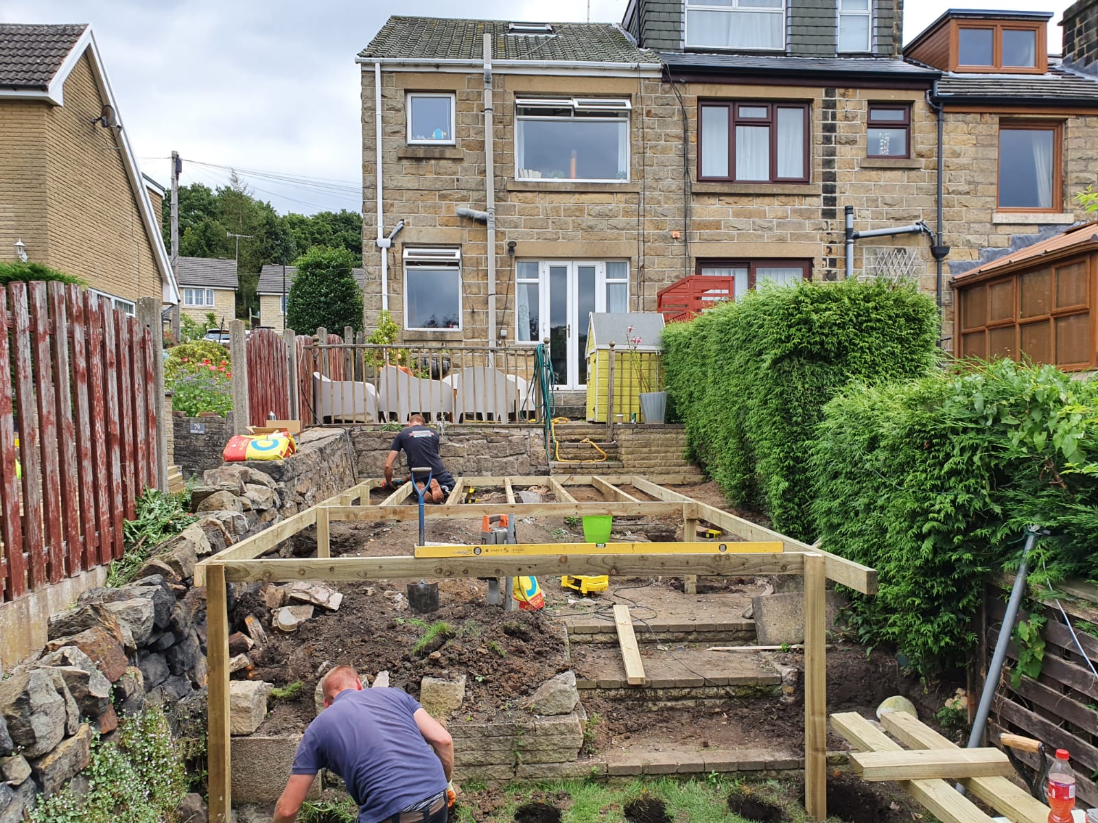 Raised wooden decking being constructed in a Cardiff back garden