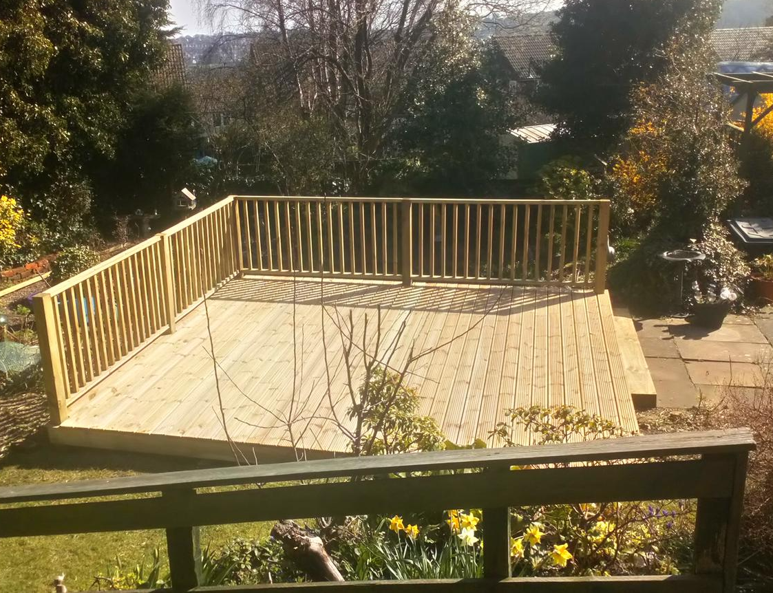 large wooden decking across steep slope in Cardiff