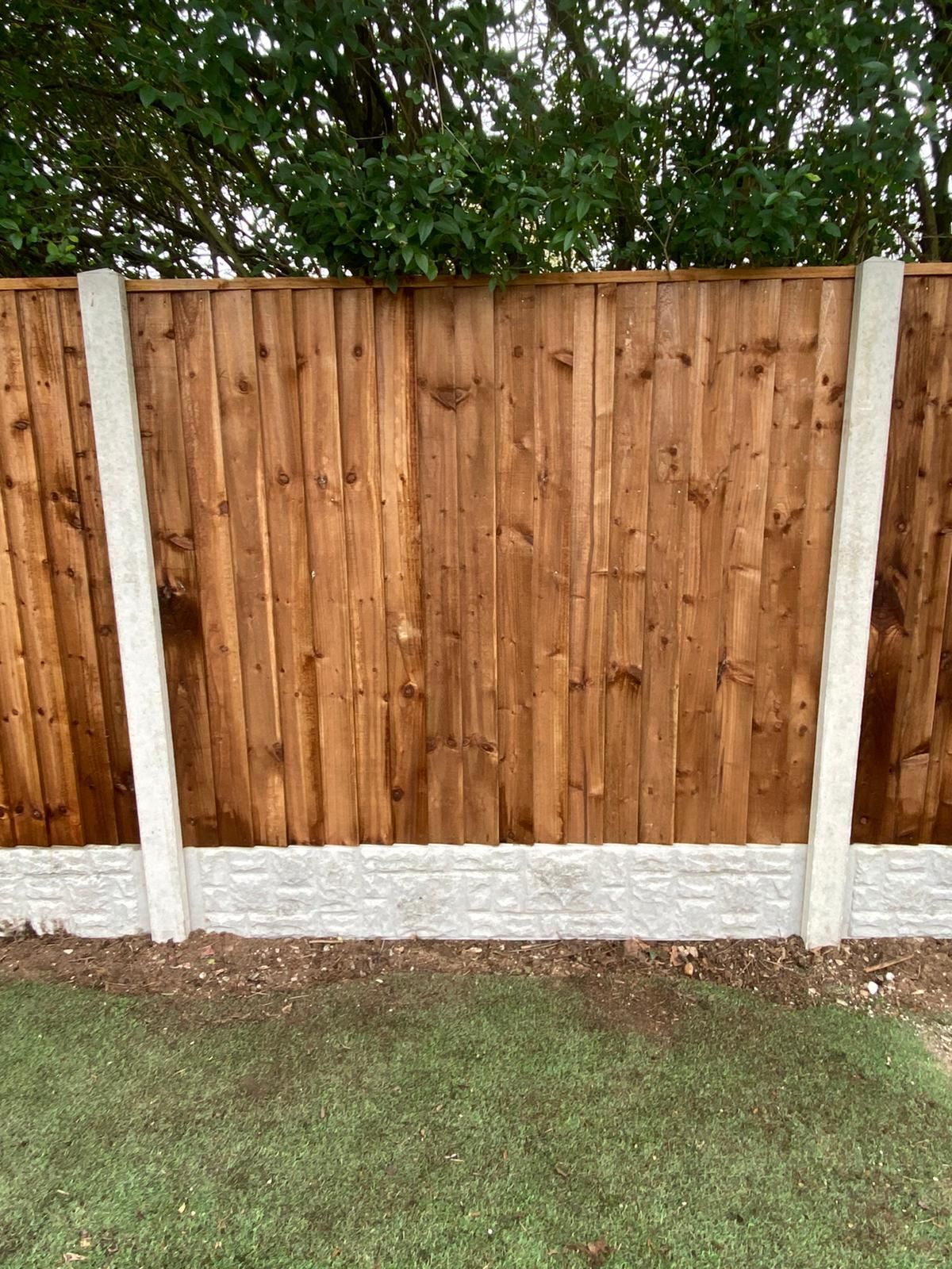 J&Z Fencing Barry wooden garden fence with concrete posts and rock faced gravel boards