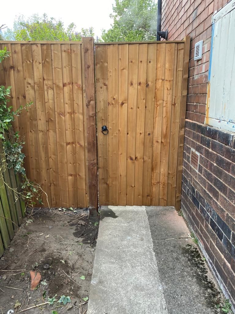 wooden garden gate with fencing