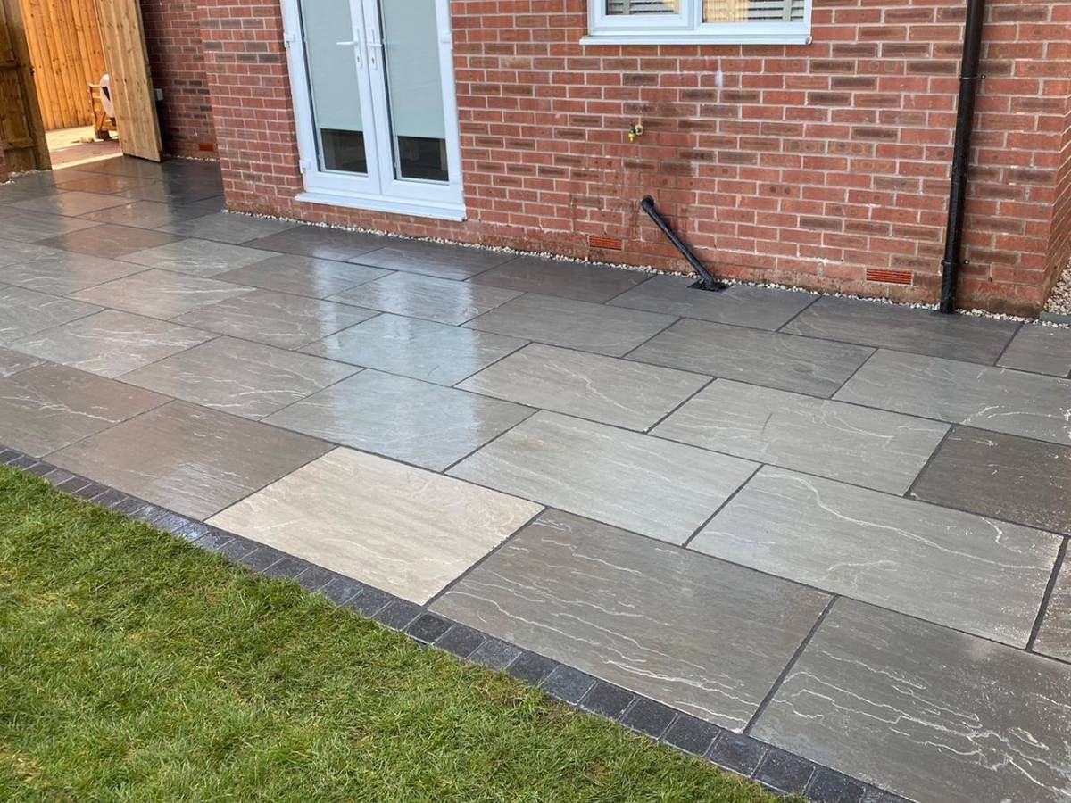 J&Z Fencing grey paving to provide a back garden patio