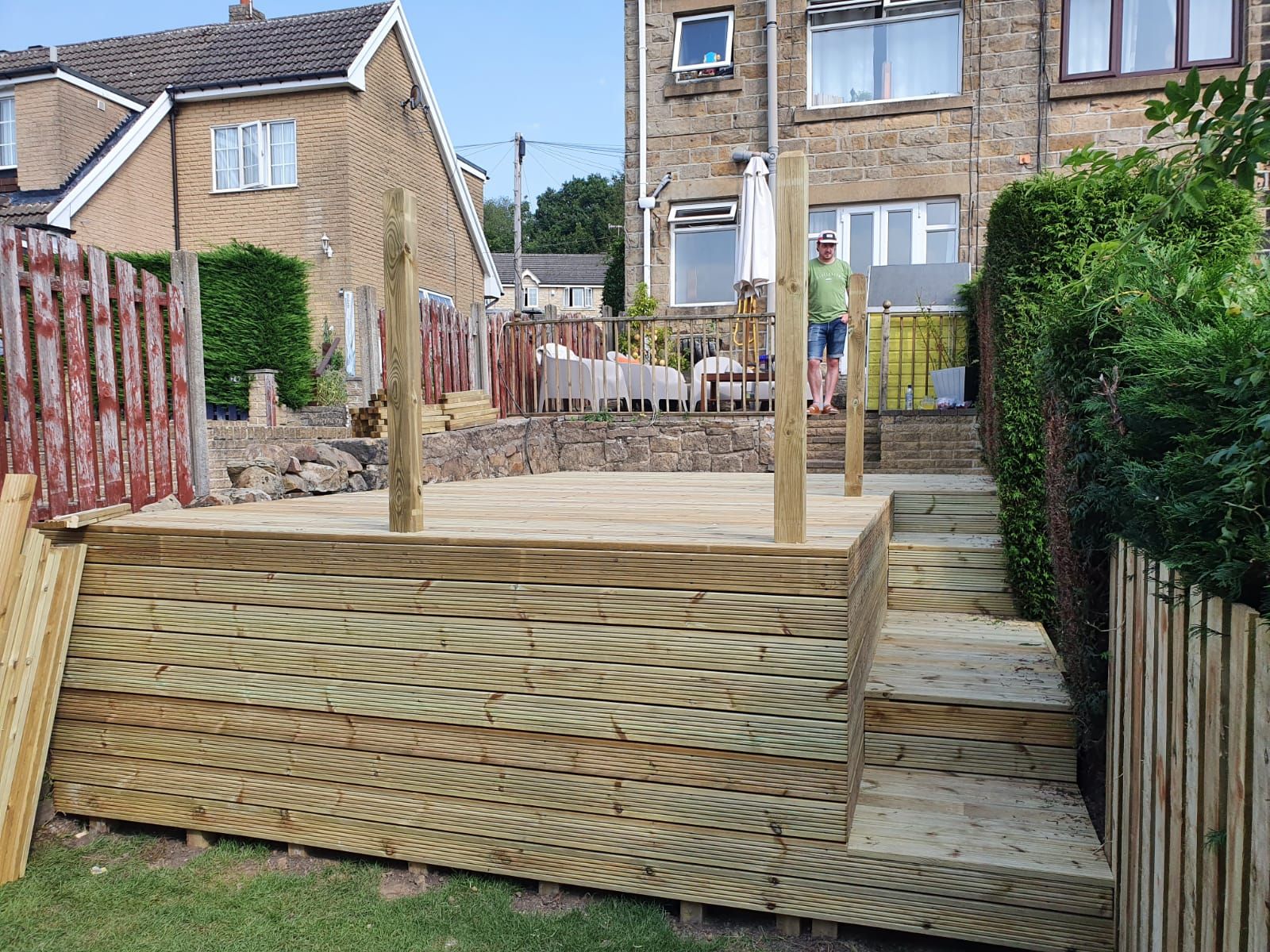 Raised wooden decking being constructed in a Dinas Powys back garden
