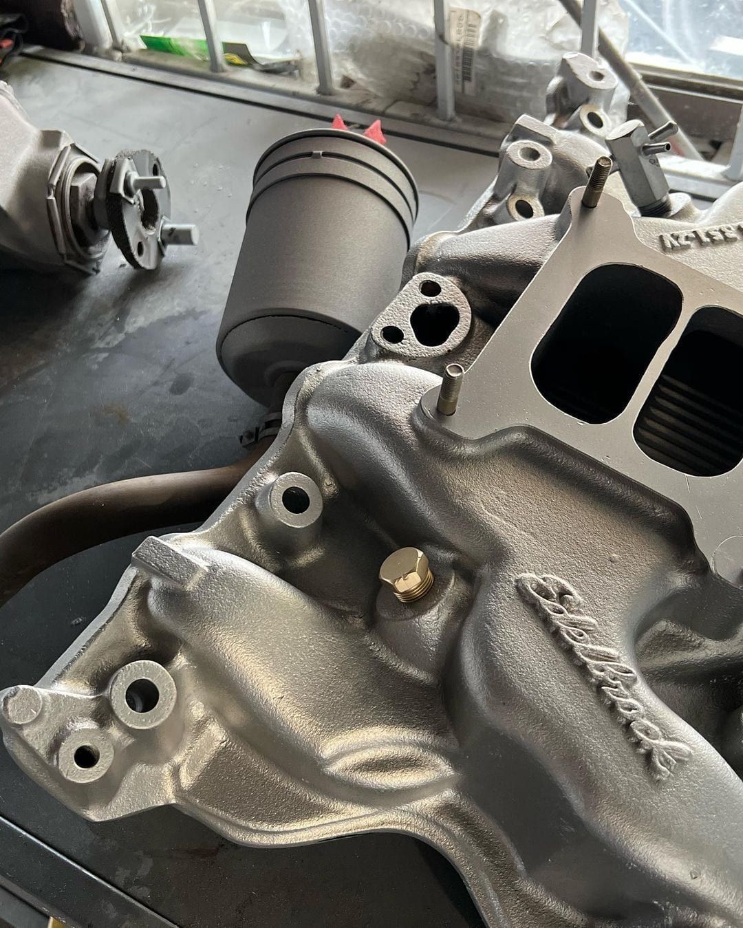 A close up of a intake manifold on a table