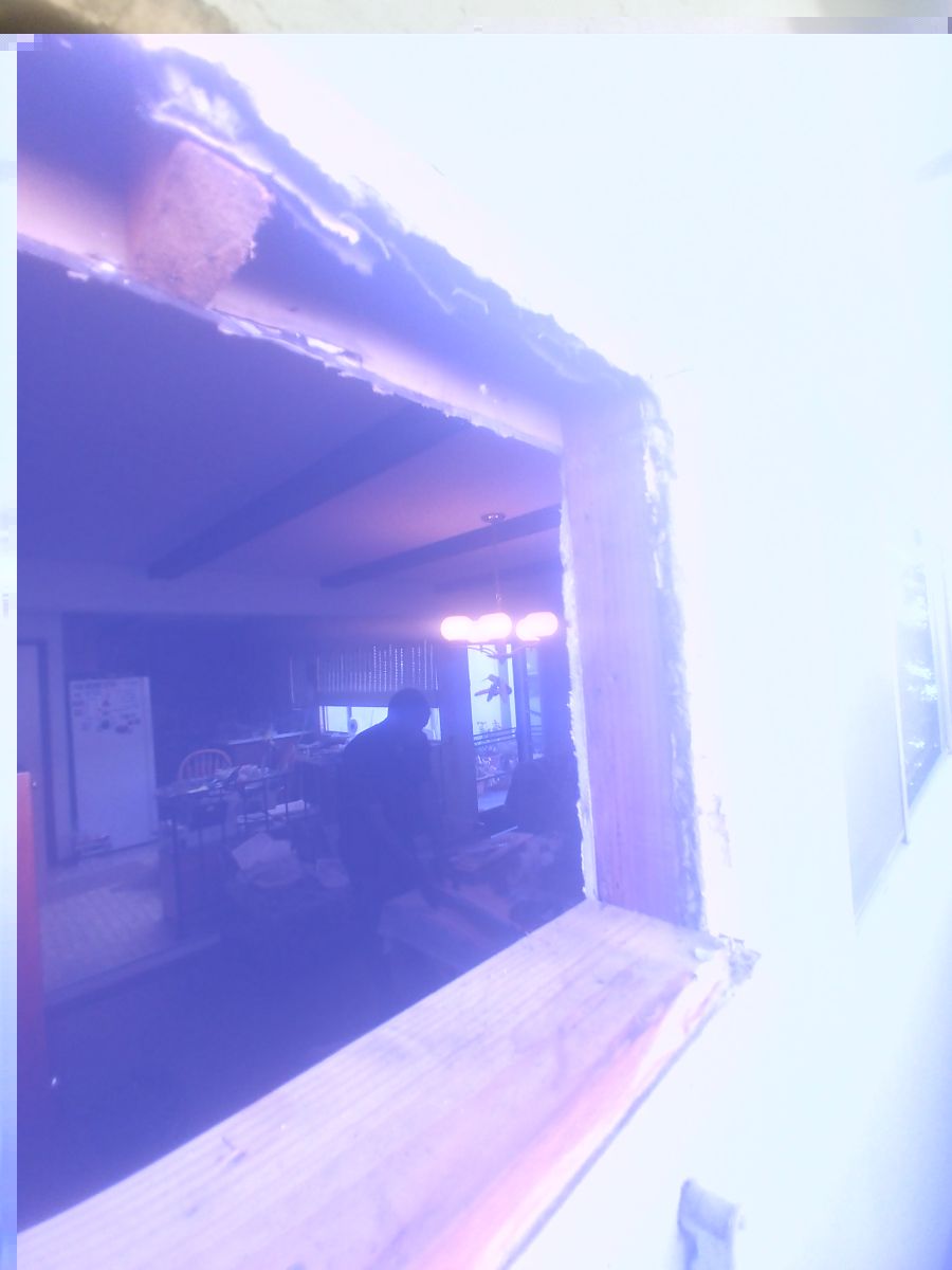 A blurry picture of a room with a sign that says ' a ' on it