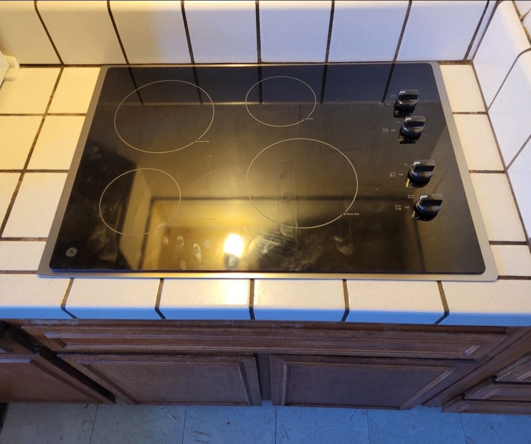 A stove top oven is sitting on a kitchen counter