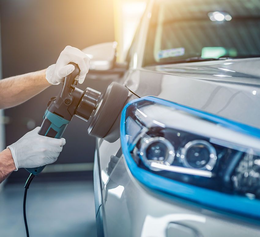 A Person is Polishing a Car With a Machine — Platinum Hand Car Wash & Detailing in Belconnen, ACT