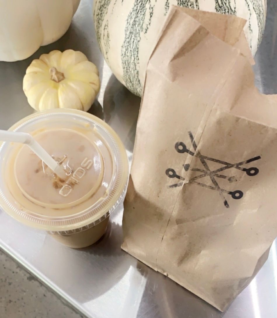 A brown paper bag with scissors written on it