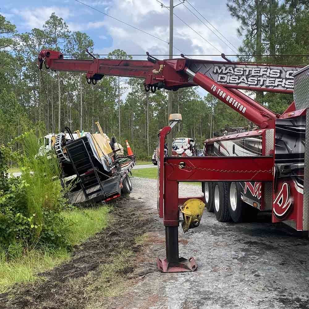 Red Tow Truck Towing Yellow Construction Truck — Rincon, GA — Rahn’s Services