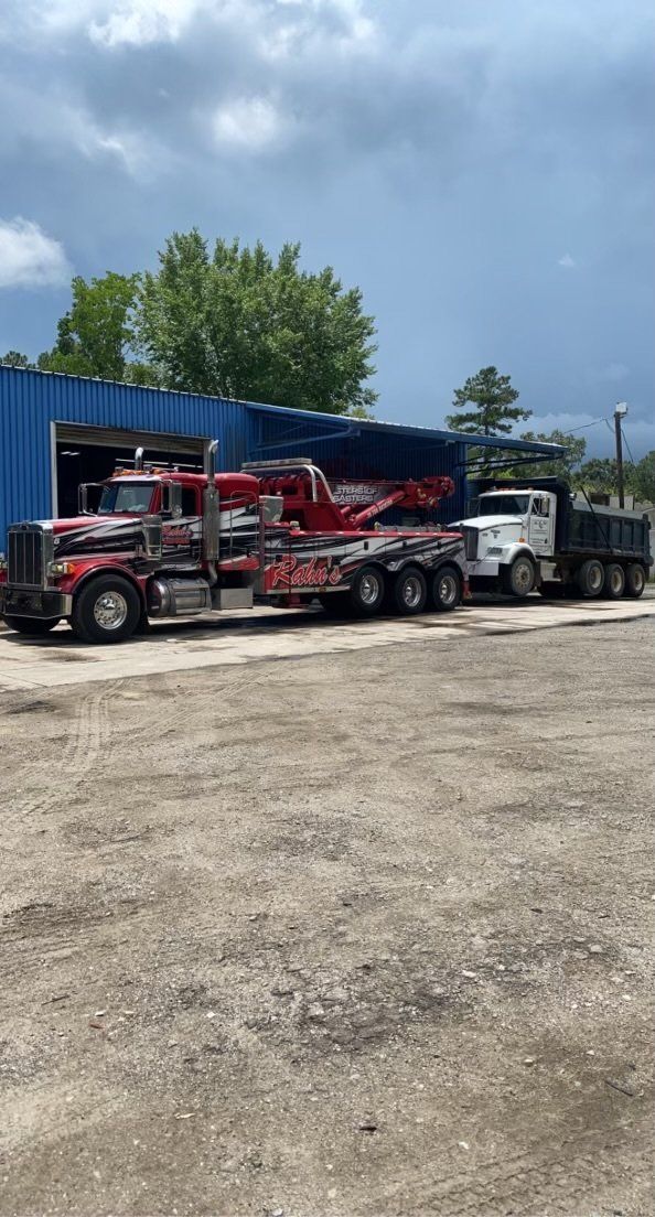 Red Tow Truck Towing A Dump Truck — Rincon, GA — Rahn’s Services
