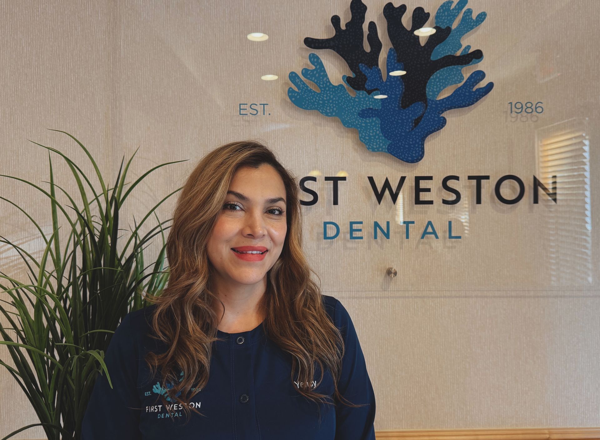 Woman smiles in front of 