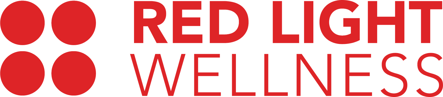 A red light wellness logo with two red circles on a white background.