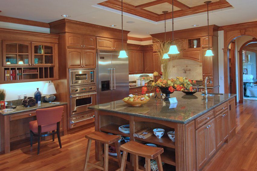 A kitchen with a large island in the middle of it