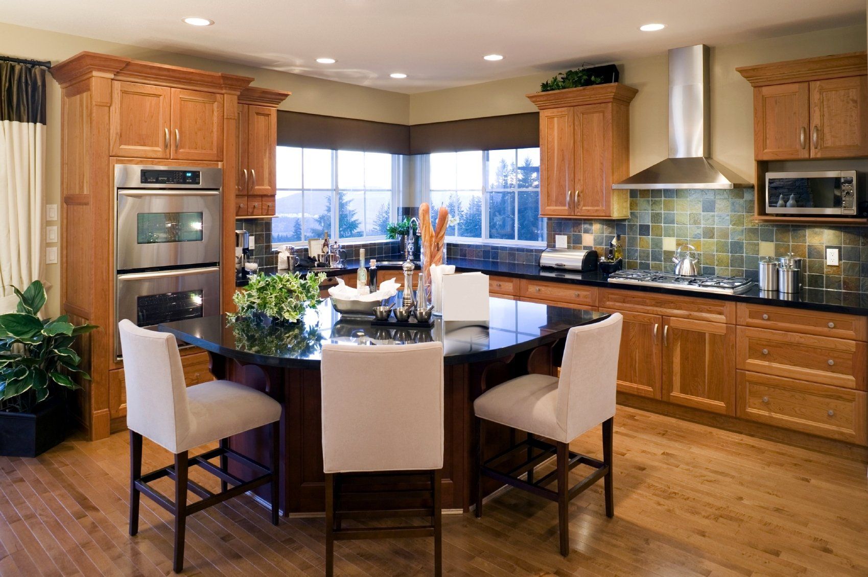A kitchen with stainless steel appliances and wooden cabinets
