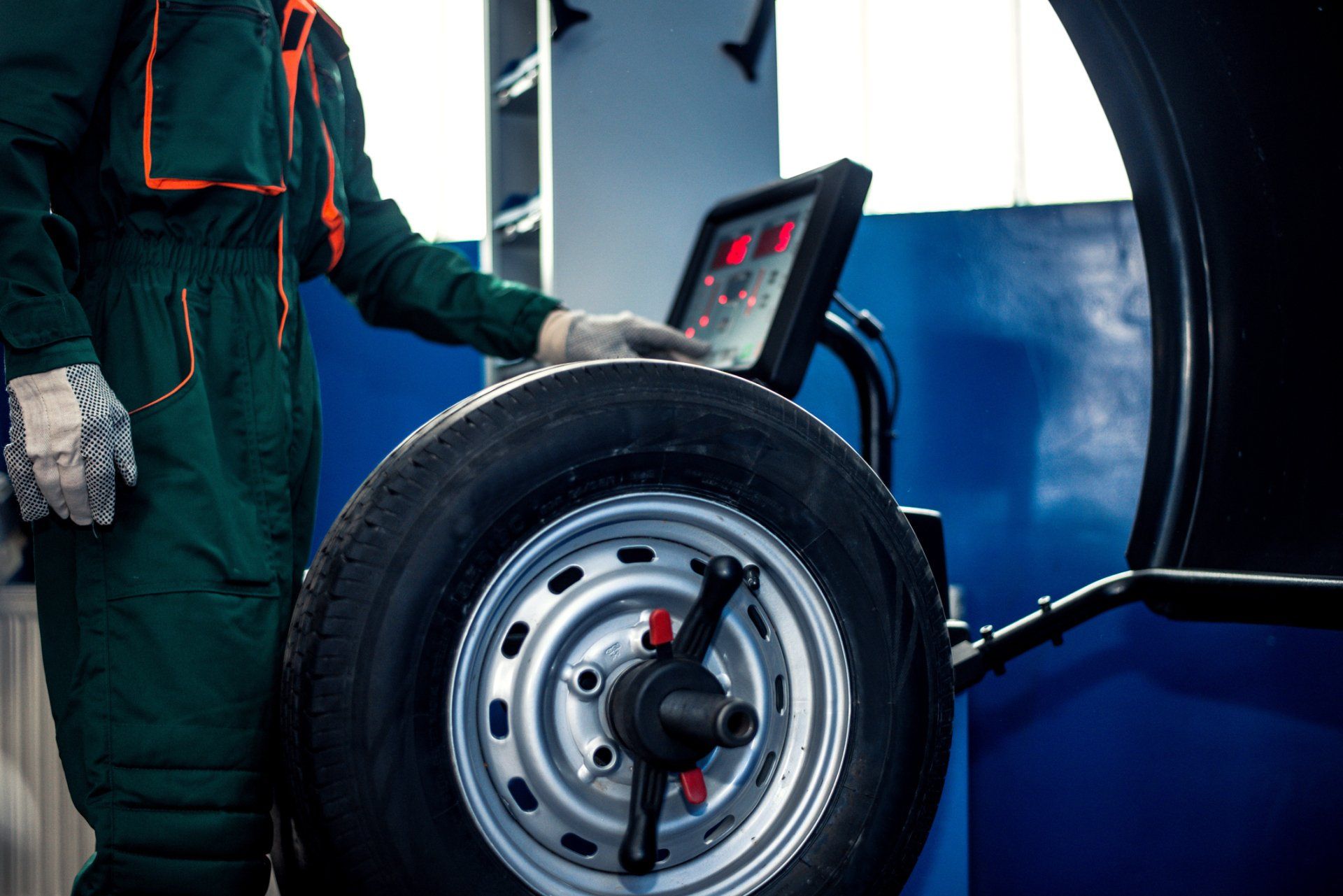 Mechanic Man Working On Balancing Machine - Slacks Creek, QLD - Happy Tyres Moss Street