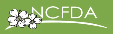 Logo for NCFDA featuring white dogwood flowers on a green background with white text.