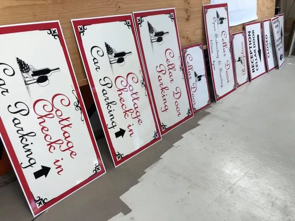 Several signs are lined up including one that says 