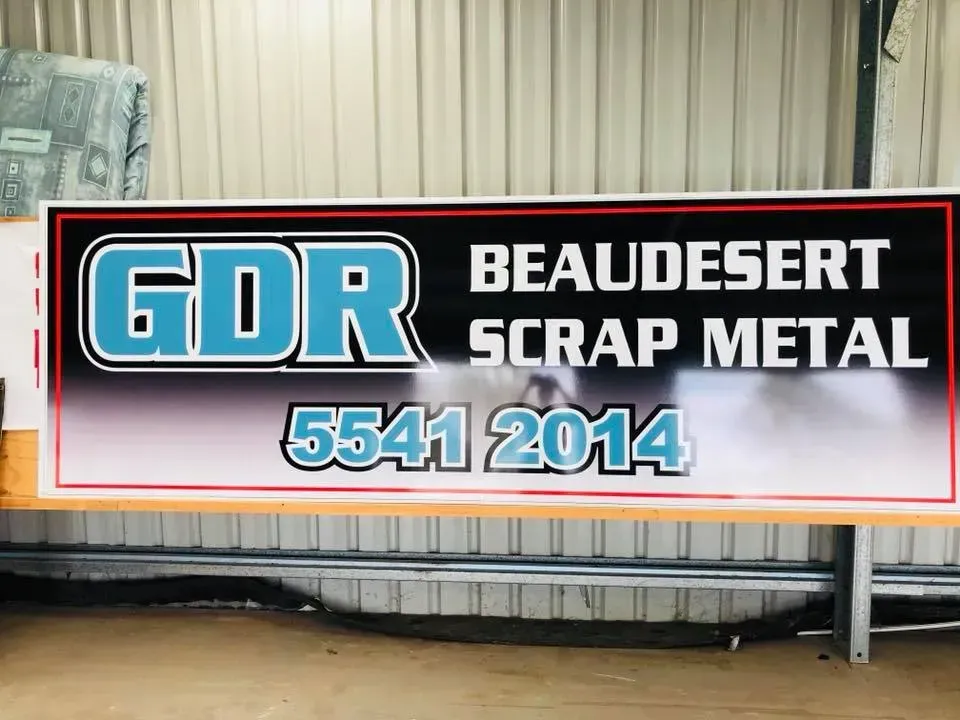 A sign that says gdr beaudesert scrap metal on it