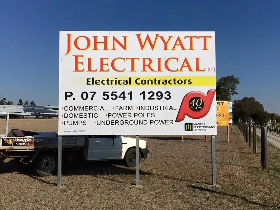 A sign for john wyatt electrical electrical contractors