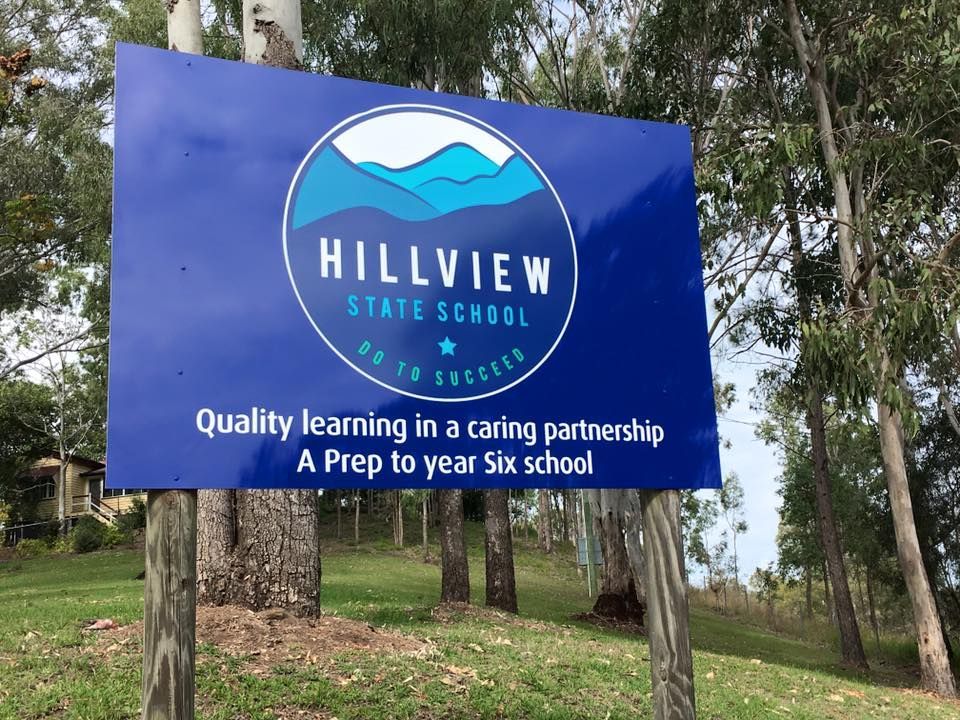 A sign for hillview state school says quality learning in a caring partnership a prep to year six school