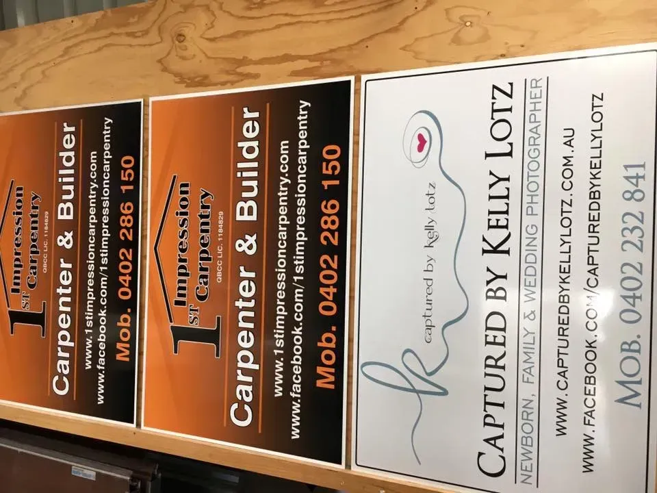 A bunch of signs that say carpenter and builder on them