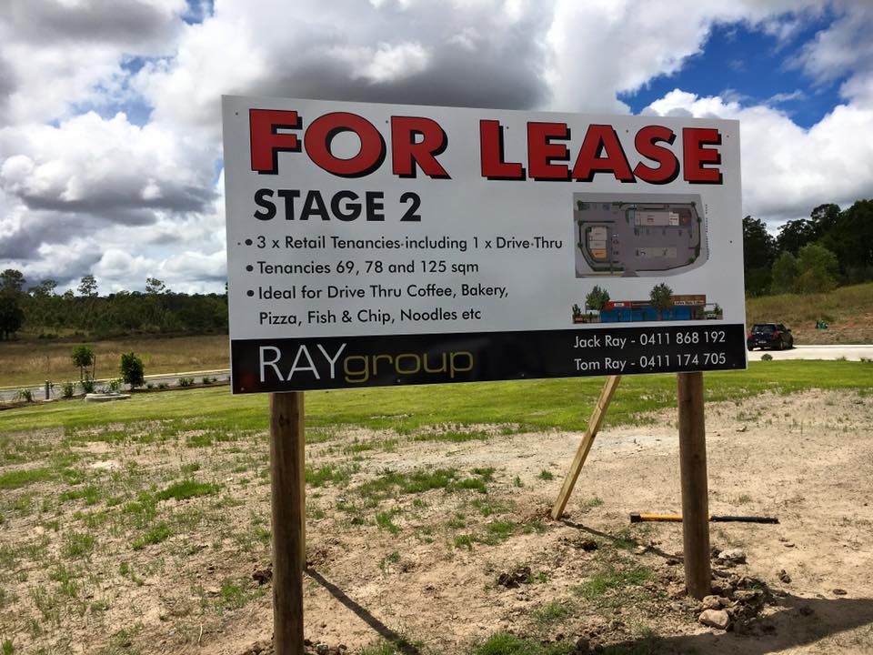 A sign that says for lease stage 2 on it