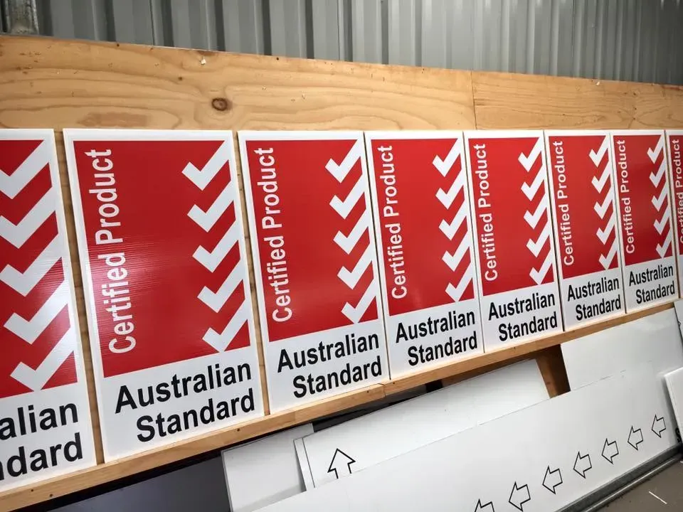 A row of certified product australian standard signs