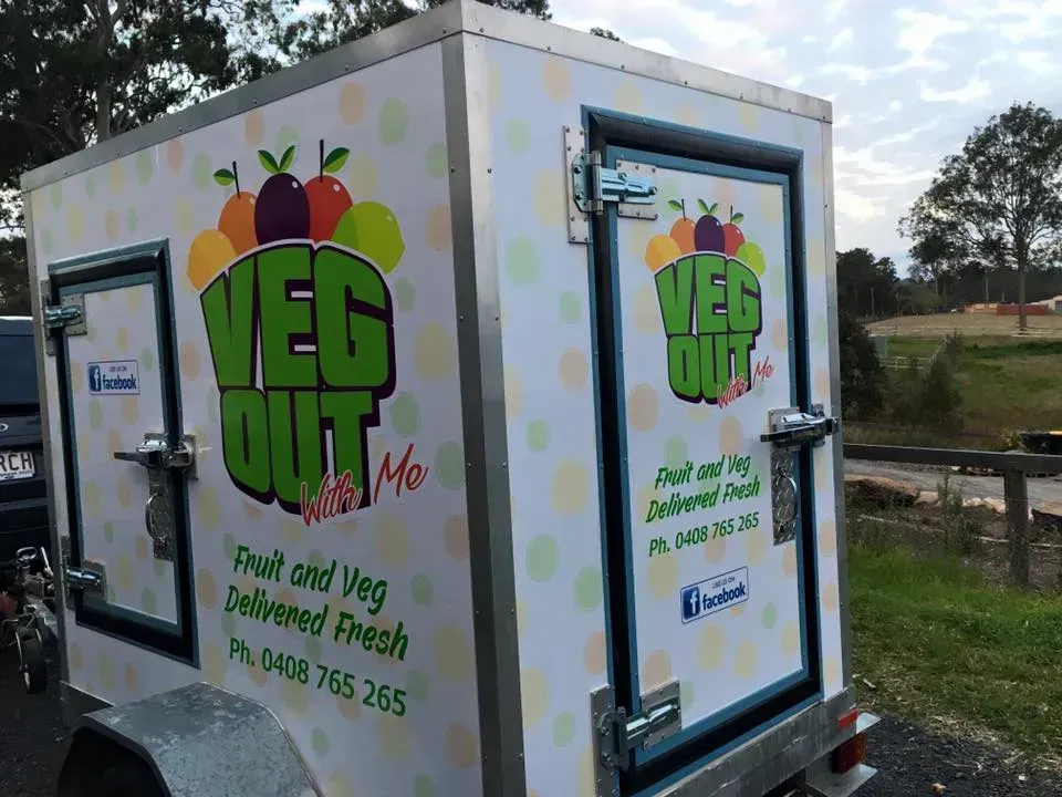 A white trailer with the words veg out on it