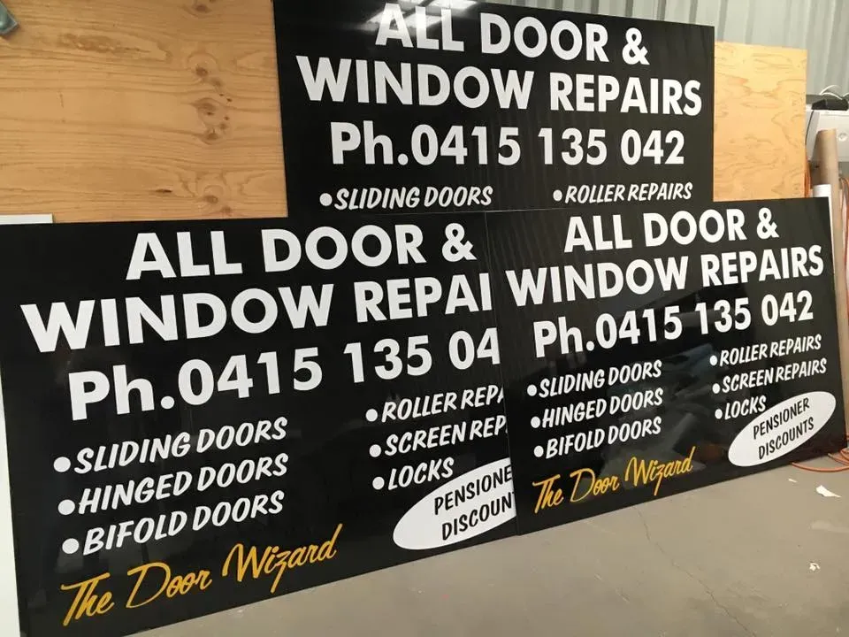 A sign that says all door and window repairs on it