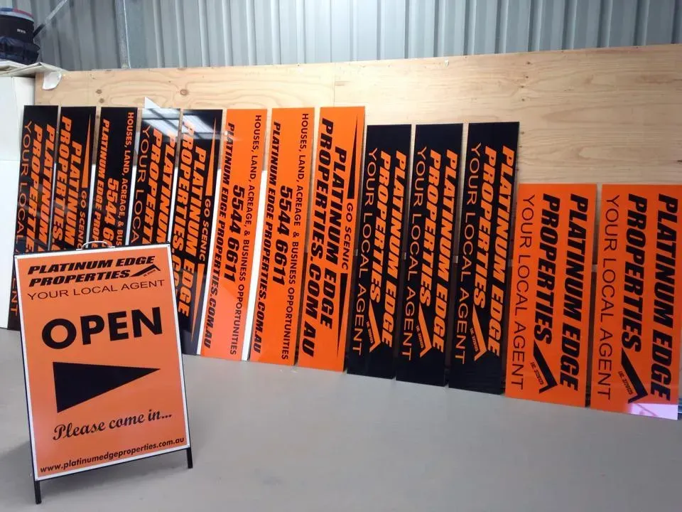 A bunch of signs for platinum edge properties