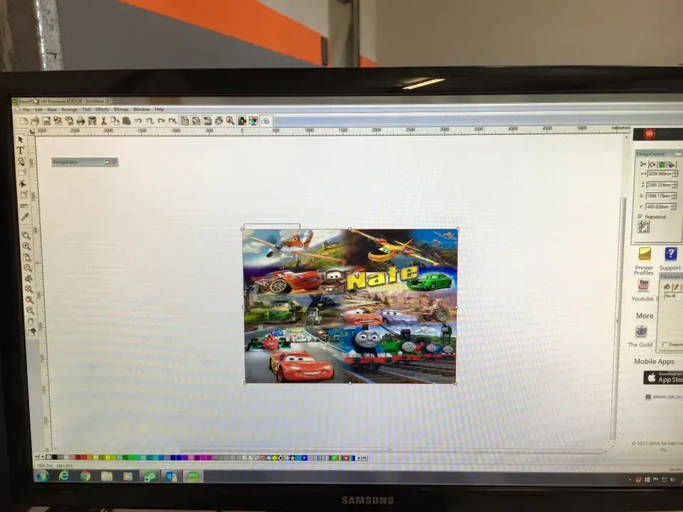 A computer screen with a picture of cars and thomas on it