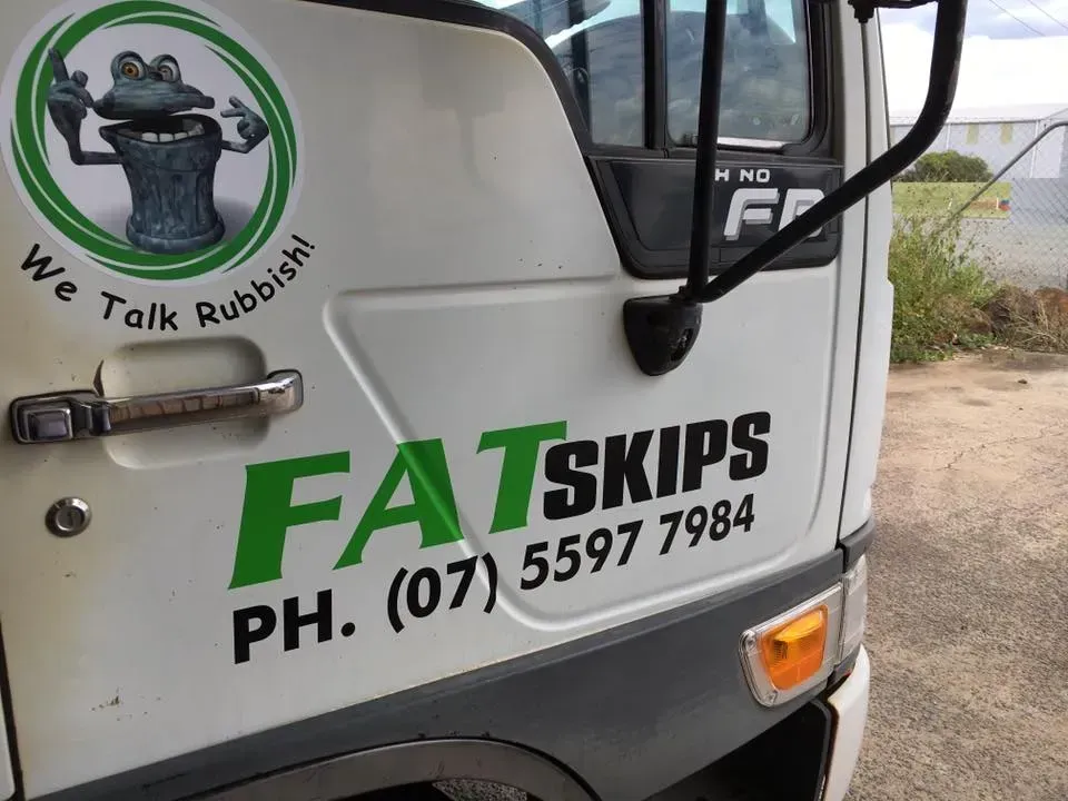 A white truck with fatskips written on the side