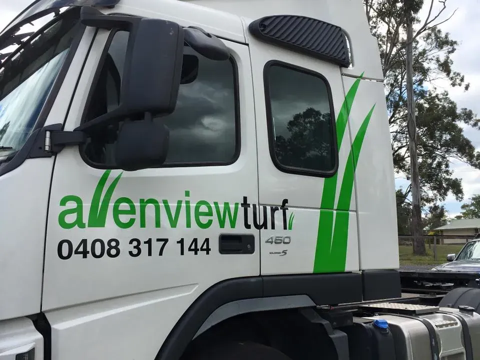 A white truck with the word allenview turf on the side