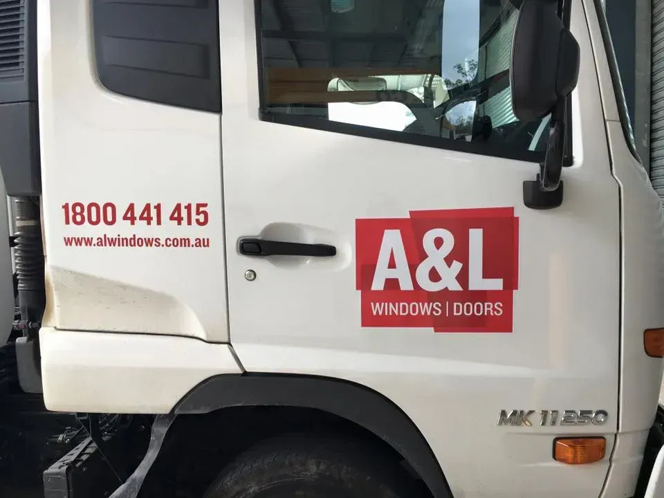 A white truck with the word a & l on the side